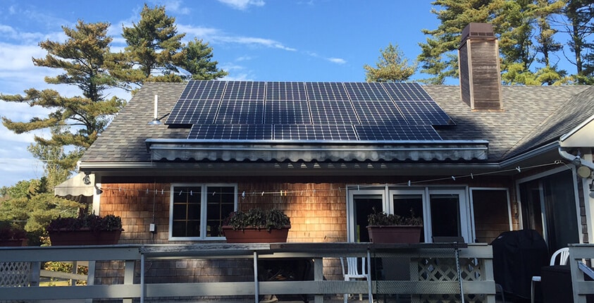 home in marion, ma with solar panels on rooftop