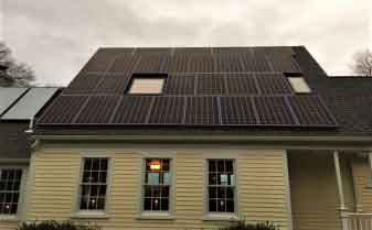 Residential home in Marshfield, MA with solar insulation on rooftop