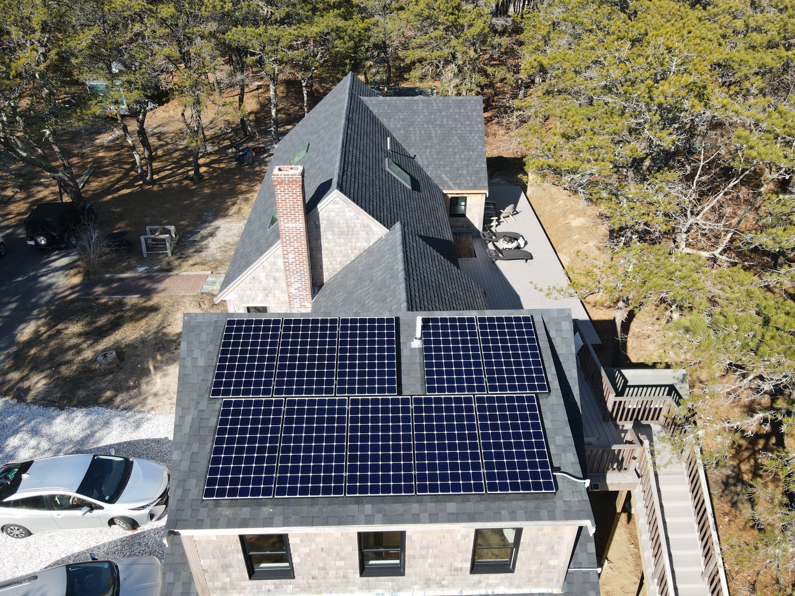 shingled house with rooftop solar panels