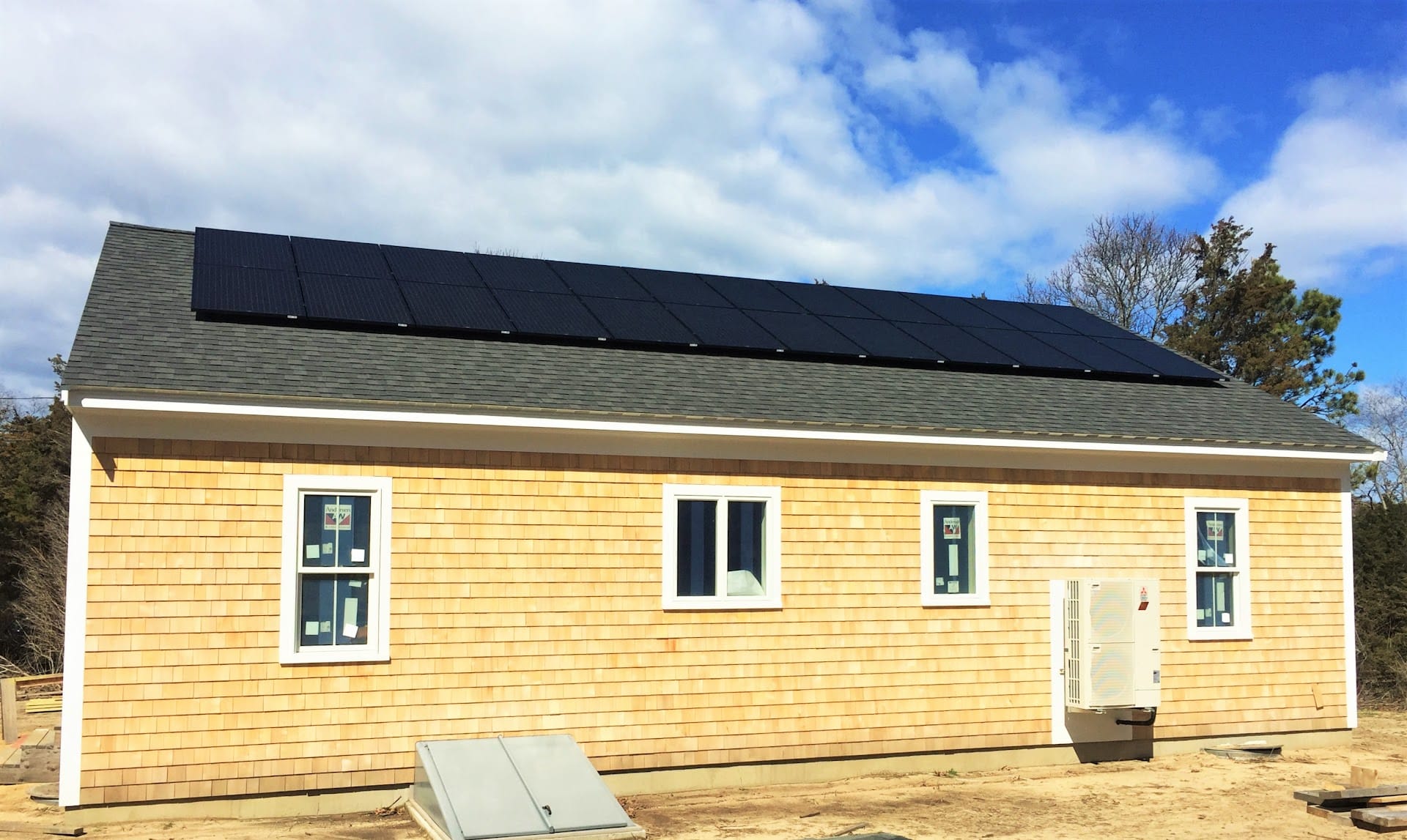 new single story house with rooftop solar panels